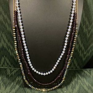 Triple strand statement AB faceted beaded necklace. Very sparkly
